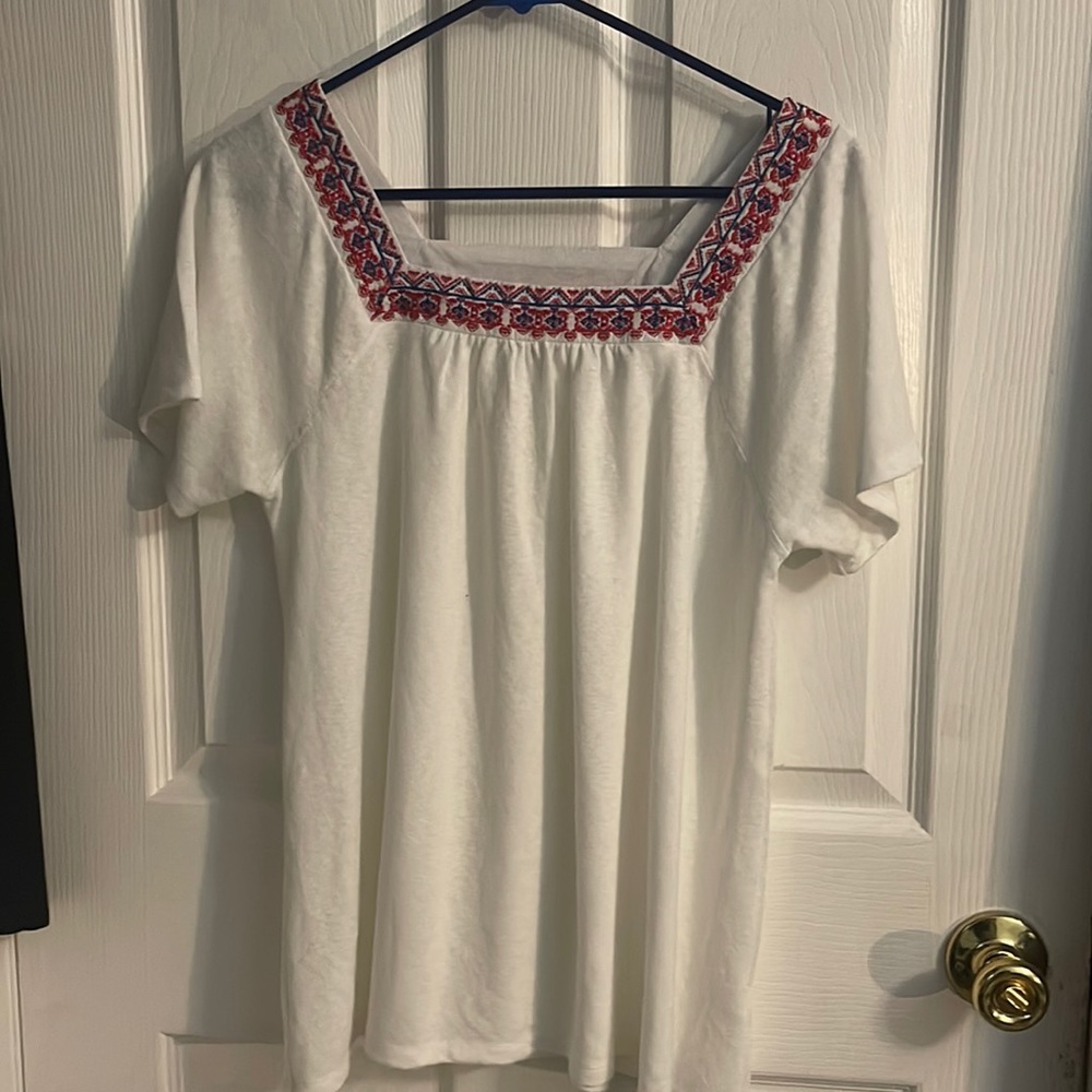 White blouse with red and blue accents
